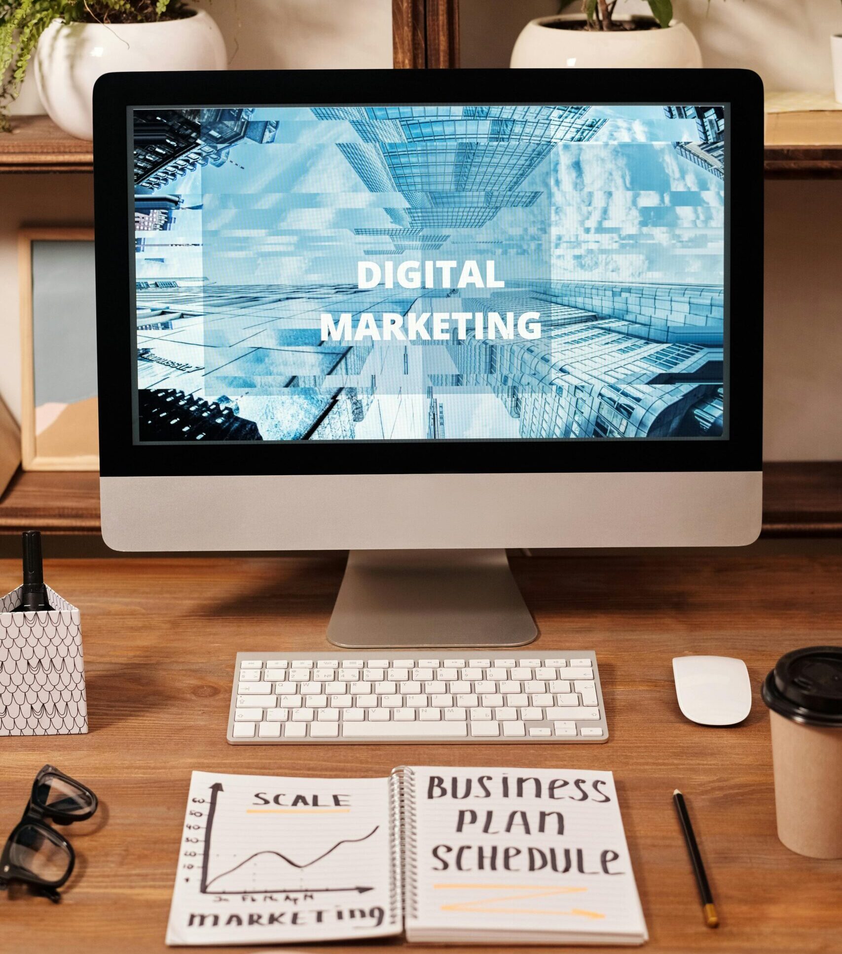 Contemporary office setup featuring digital marketing strategy on a computer screen, ideal for business technology themes.