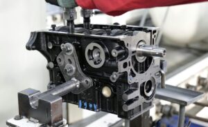 Close-up of engine assembly process highlighting industrial precision