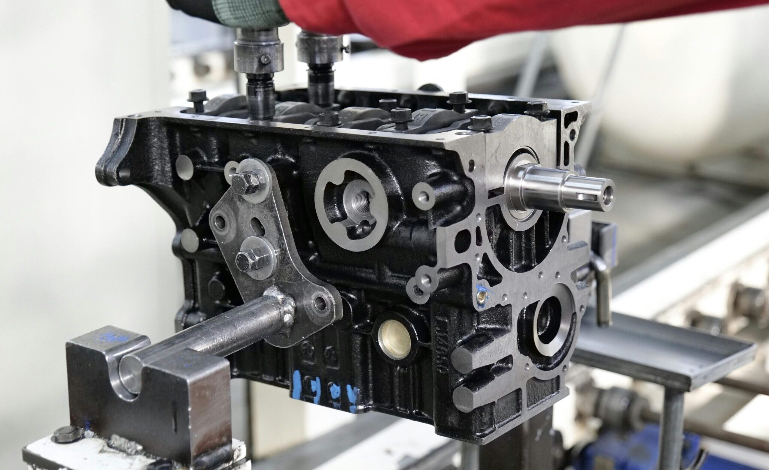 Close-up of engine assembly process highlighting industrial precision