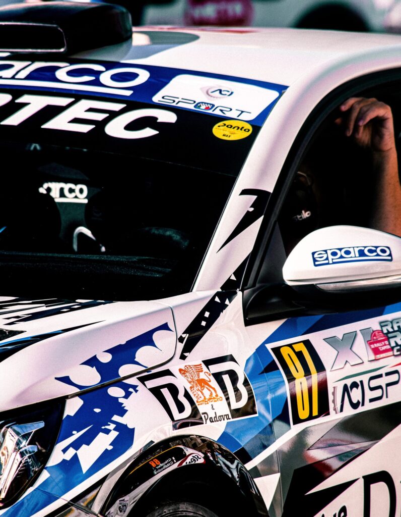 Close-up view of a colorful racing car showcasing vibrant decals and sleek design.